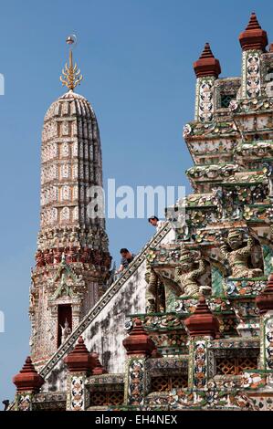 Thailand, Bangkok, Wat Arun, two men going down the steep stairs Stock Photo