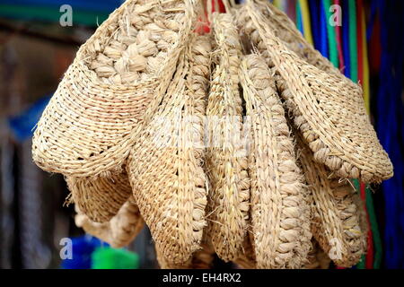 Traditional nepalese hempen shoes set for sale hanging at the entrance to a shop in the old city area. Panauti-Kavrepalanchok ds Stock Photo