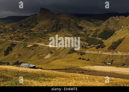 Ecuador, Cotopaxi, Tigua, Andean landscape of a valley in a mountainous setting under a stormy sky Stock Photo