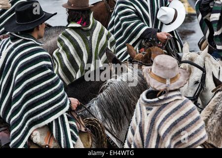 Ecuador, Ambato, Pelileo, concentration of riders in traditional poncho over a local festive celebration Stock Photo