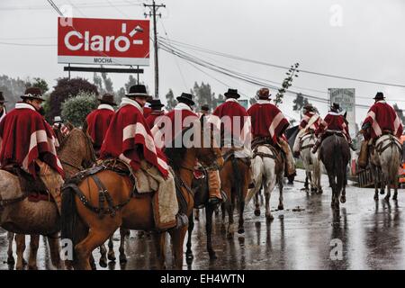 Ecuador, Ambato, Pelileo, concentration of riders in traditional poncho over a local festive celebration Stock Photo