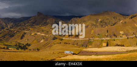 Ecuador, Cotopaxi, Tigua, Andean landscape of a valley in a mountainous setting under a stormy sky Stock Photo