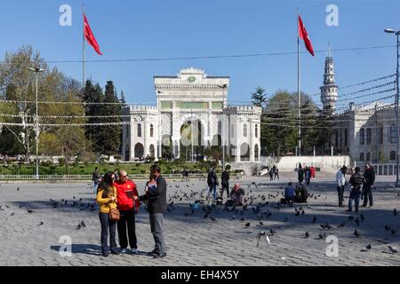 Turkey, Istanbul, Beyazit district, Stamboul university, passersby and pigeons in the square in front of the university gate Stock Photo