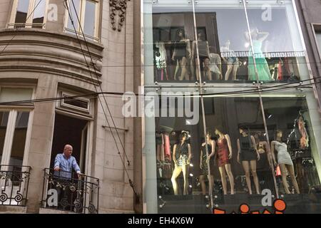 Turkey, Istanbul, SIraselviler Caddesi, Turkish man in the balcony of a neoclassical building of a shopping street Stock Photo
