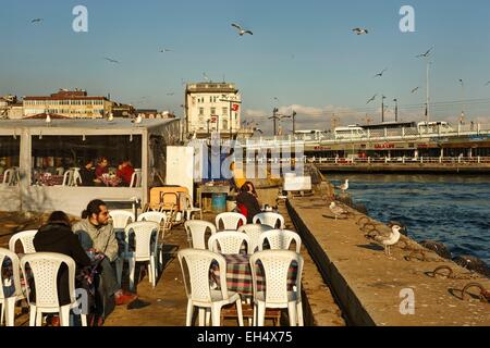 Turkey, Istanbul, Karakoy district, cafes on the Bosphorus near the Galata Bridge Stock Photo