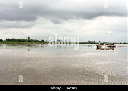 Gabon, Ogooue-Maritime Province, motor boat going up the Ogooue river Stock Photo