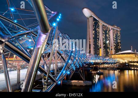 Singapore, Marina Bay, Marina Bay Sands hotel designed by the architect Moshe Safdie in the evening, viewed from the Helix bridge Stock Photo