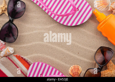 Accessories for the beach lying on the sand, with place for your text Stock Photo