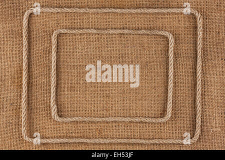 Two frame of rope, lies on a background of burlap, with place for your text Stock Photo