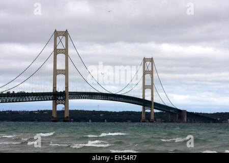 Mackinac Bridge, as seen from the Michigan shoreline where Lake Huron and Lake Michigan meet at the straits of Mackinac. Stock Photo
