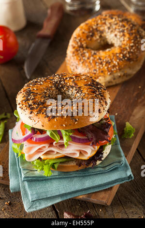 Healthy Turkey Sandwich on a Bagel with Lettuce and Tomato Stock Photo