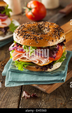 Healthy Turkey Sandwich on a Bagel with Lettuce and Tomato Stock Photo