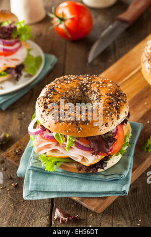 Healthy Turkey Sandwich on a Bagel with Lettuce and Tomato Stock Photo