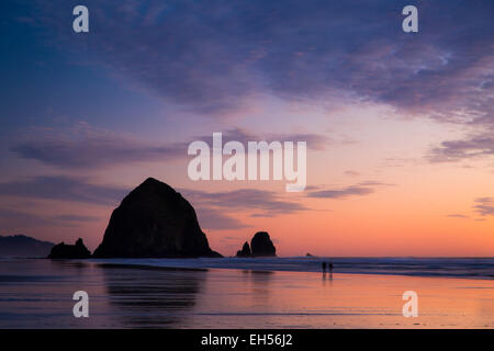 Sunset over Haystack Rock along the Oregon Coast at Cannon Beach, USA Stock Photo