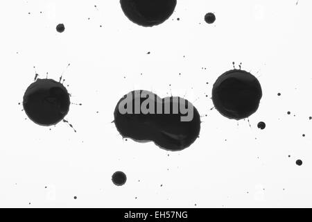 Ink or oil splat and drips Stock Photo