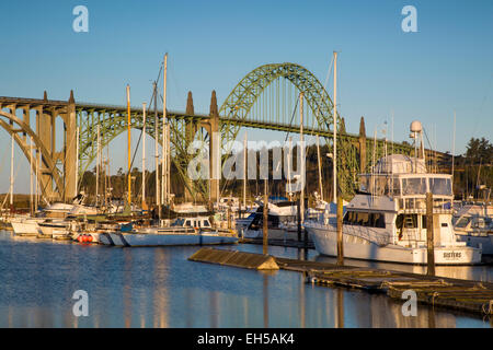 Dawn in Newport Harbor with Yaquina Bay Bridge beyond, Newport, Oregon, USA Stock Photo