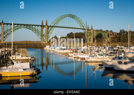 Dawn in Newport Harbor with Yaquina Bay Bridge beyond, Newport, Oregon, USA Stock Photo