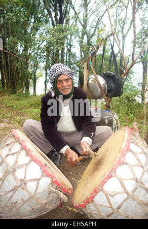 Image of a drummer beating the drum during a marriage function Stock Photo