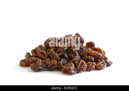 A pile of raisins on white background Stock Photo