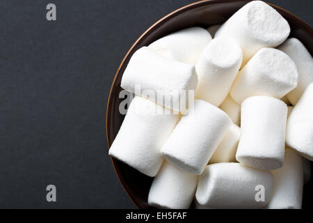 white marshmallows on black background Stock Photo