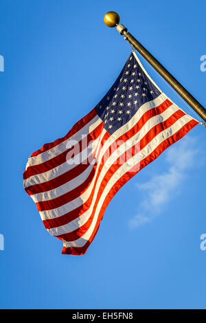 Photo of American flag waving in the wind Stock Photo