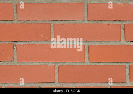 background of the brick wall created from the red bricks Stock Photo