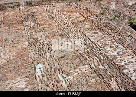 Brick mosaic floor in part of the Arsinoe Fountain House in Ancient Messene (Messini), The Pelonnese, Greece Stock Photo