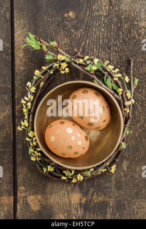 Eggs with golden dots in a golden bowl Stock Photo