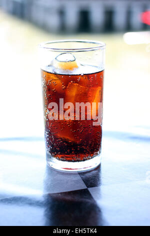 Cola in glass on the table. Stock Photo