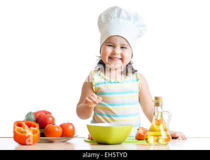 toddler girl preparing healthy food in the kitchen Stock Photo