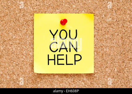 You Can Help handwritten on yellow sticky note. Stock Photo