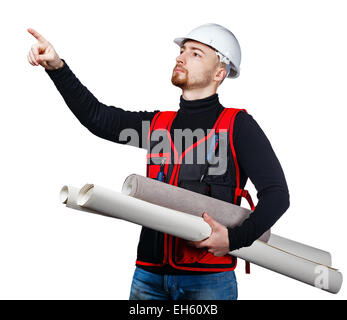 Professional builder in helmet holding a blueprint and wallpaper, twisted into rolls, pointing somewhere finger, isolated Stock Photo