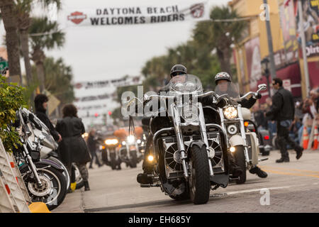 Bikers ride down Main Street during the 74th Annual Daytona Bike Week March 7, 2015 in Daytona Beach, Florida. Stock Photo