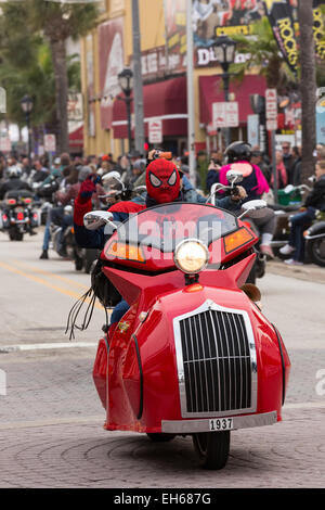 A biker wearing a spider man costume cruises down Main Street during the 74th Annual Daytona Bike Week March 7, 2015 in Daytona Beach, Florida. Stock Photo