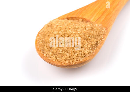 brown sugar in a wooden spoon on white background Stock Photo