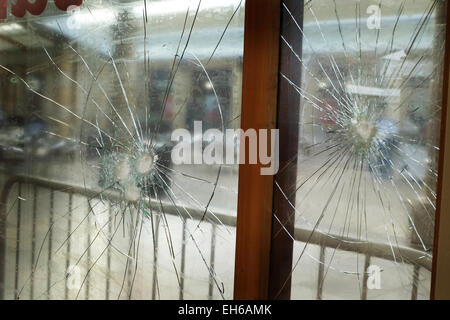 Broken armored glass in jewelry shop window. Stock Photo