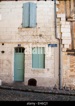 Front door and closed shutters in Bergerac, France Stock Photo