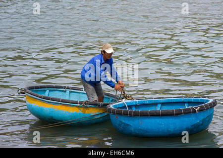 Fishermen in the traditional round boat, Vinh Hy, Vietnam, Southeast Asia Stock Photo