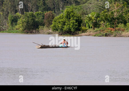A man is riding in a canoe on the Mekong, Mekong Delta, Vietnam, Asia Stock Photo