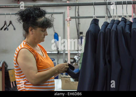 Female Worker Checking Jackets On Hangers, Astibo Garment Factory, Štip Stock Photo