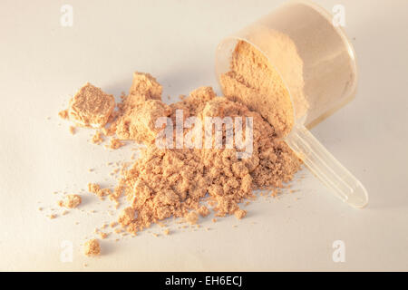 Premium Photo  Whey protein in scoop on a white background.