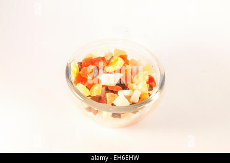 Dry fruits in glass, isolated on white background Stock Photo