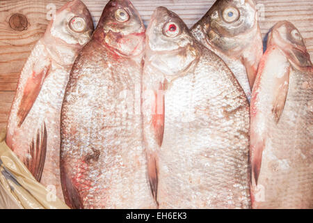 A lot of carp bream, on wooden background Stock Photo