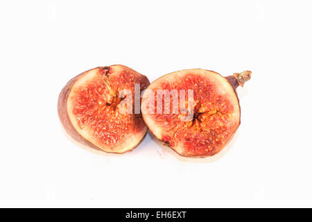 Two halves of purple figs, isolated on white background Stock Photo