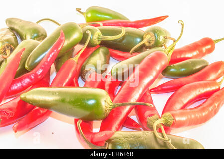 Red chili and green jalapenos, on isolated white background Stock Photo