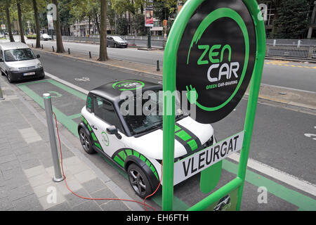 A Zen Car (car sharing) electric car plugged in to a road side power source in Brussels, Belgium. Stock Photo
