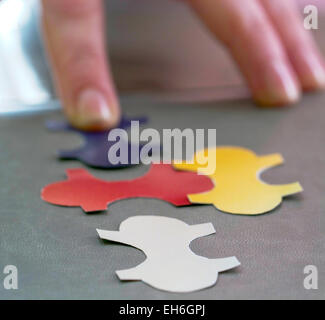 Fitting the last piece of puzzle in place. Stock Photo