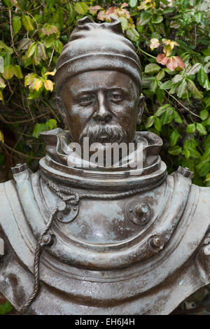 Statue of William Walker MVO (1869–1918)in the grounds of Winchester Cathedral: the diver 'who saved' Winchester Cathedral. UK. Stock Photo