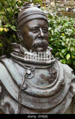 Statue of William Walker MVO (1869–1918)in the grounds of Winchester Cathedral: the diver 'who saved' Winchester Cathedral. UK. Stock Photo