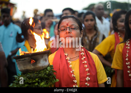 Woman hindu pilgrim with fire kavaldi walking to Batu Cave temple, Kuala Lumpur Malaysia during Thaipusam festival on 3rd FEB 20 Stock Photo